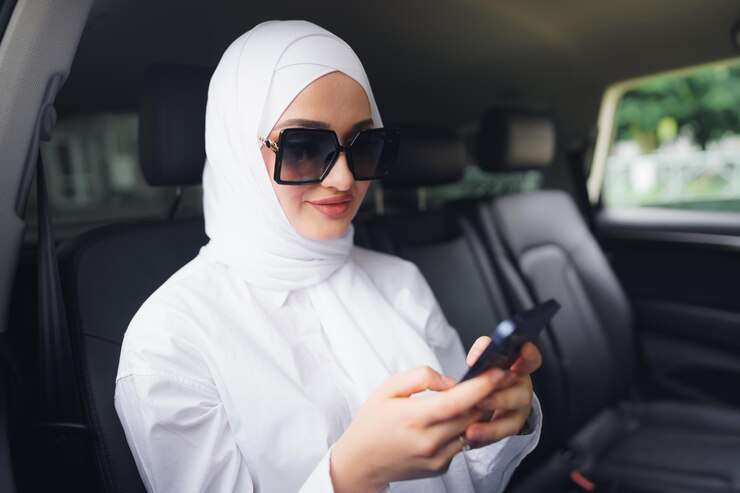 A professional driver providing Umrah Taxi Service, ensuring safe and comfortable transportation for pilgrims during their sacred journey.
