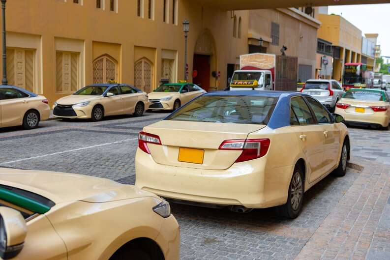 [freepicdownloader com] taxi car parked downtown dubai united arab emirates medium