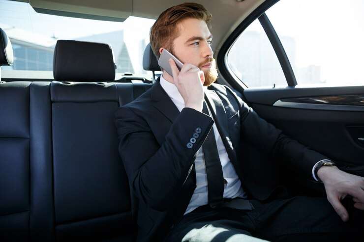 confident bearded businessman talking mobile phone