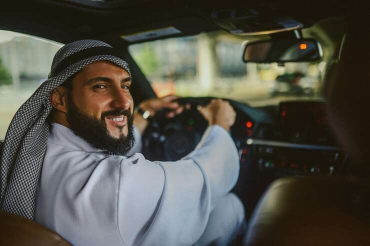 Black car parked, representing reliable Madinah Airport Taxi service for smooth and comfortable travel to and from the airport.
